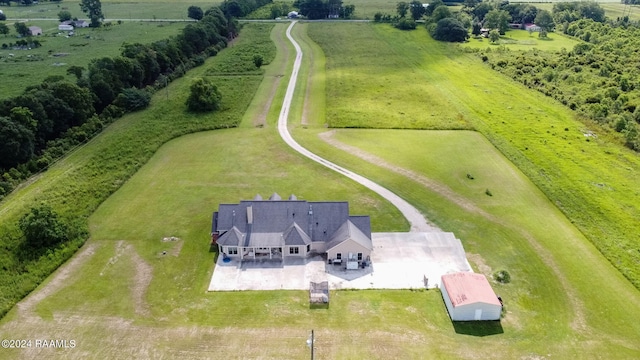 birds eye view of property featuring a rural view