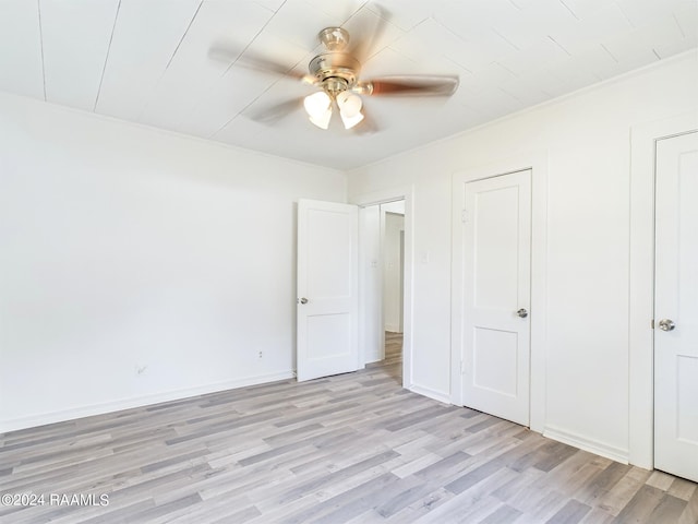 unfurnished bedroom featuring ceiling fan and light hardwood / wood-style flooring