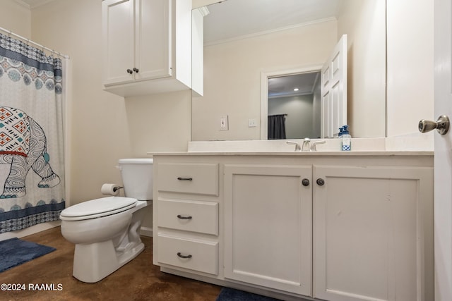 bathroom with ornamental molding, vanity, and toilet