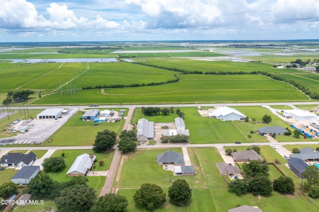 drone / aerial view featuring a rural view and a water view