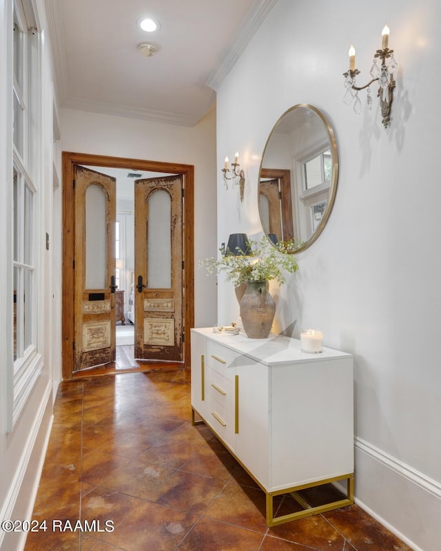 hallway featuring ornamental molding