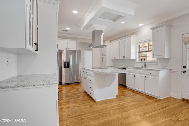 kitchen featuring a center island, island exhaust hood, white cabinetry, and stainless steel appliances