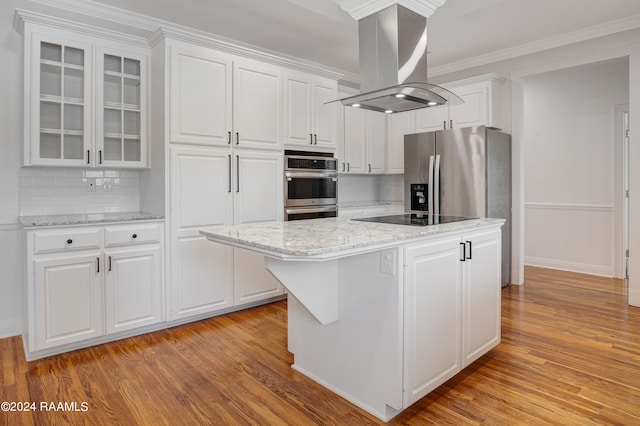 kitchen featuring white cabinetry, a center island, stainless steel appliances, tasteful backsplash, and island exhaust hood