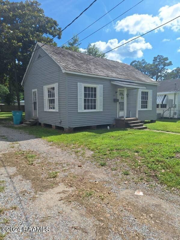 1225 W S St, Opelousas, LA 70570 - view of front of property with a front yard