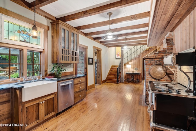 kitchen with a sink, pendant lighting, light wood finished floors, dishwasher, and brown cabinetry