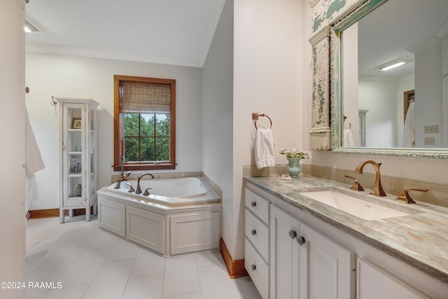 full bathroom with baseboards, ornamental molding, vanity, a garden tub, and tile patterned flooring