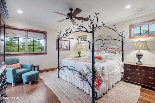 bedroom featuring crown molding, baseboards, recessed lighting, a ceiling fan, and wood-type flooring