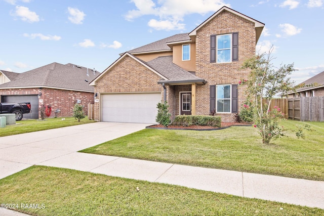 view of front of property with a garage and a front lawn