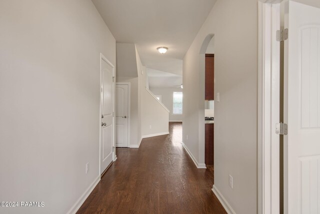 hallway with dark hardwood / wood-style floors