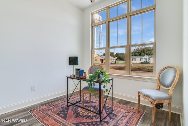 home office with dark wood-type flooring