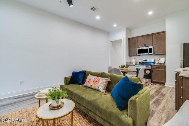 living room with light hardwood / wood-style floors