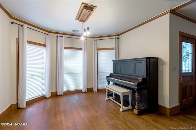 319 Goodwin St, Welsh, LA 70591 - living area featuring wood finished floors and ornamental molding