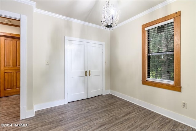 319 Goodwin St, Welsh, LA 70591 - spare room with wood finished floors, a chandelier, and ornamental molding
