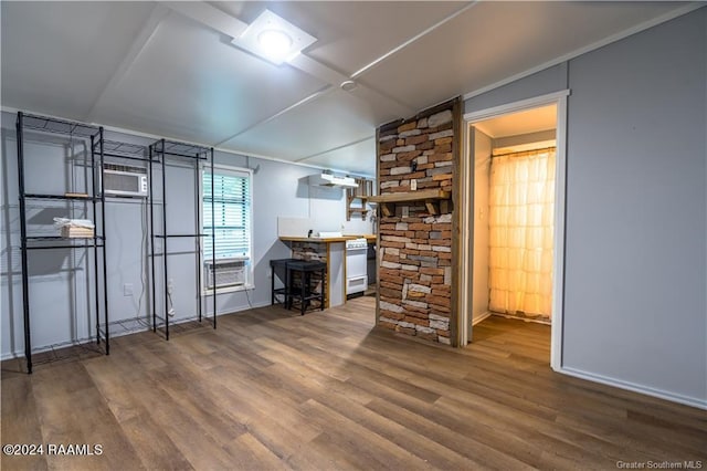 319 Goodwin St, Welsh, LA 70591 - living room featuring wood finished floors, cooling unit, a wall mounted air conditioner, and lofted ceiling