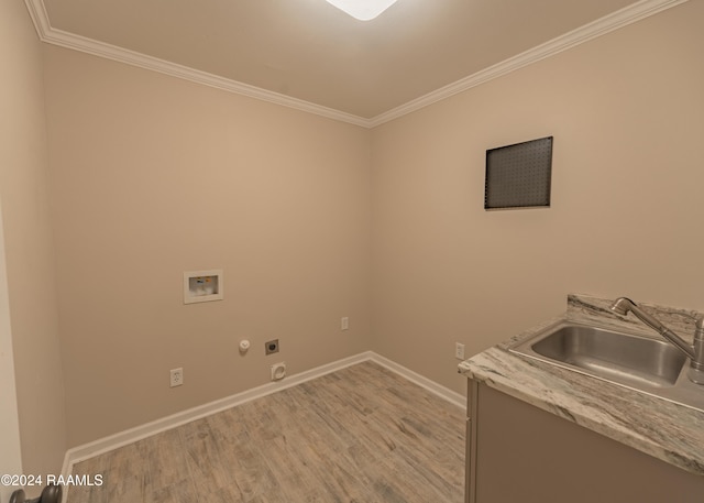 laundry room featuring sink, light hardwood / wood-style flooring, hookup for a washing machine, ornamental molding, and hookup for an electric dryer