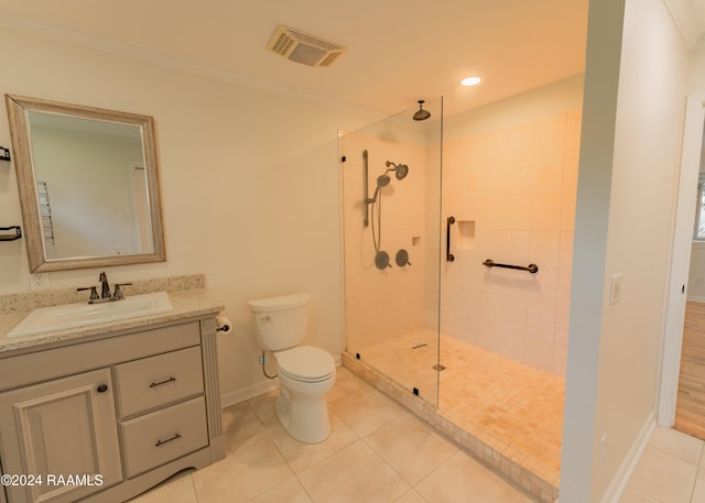 bathroom with crown molding, a tile shower, tile patterned floors, and toilet