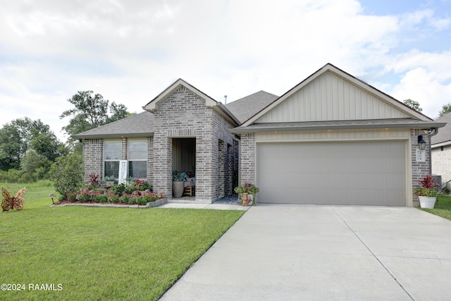 view of front facade featuring a front yard and a garage