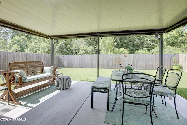 wooden terrace with a yard and an outdoor hangout area