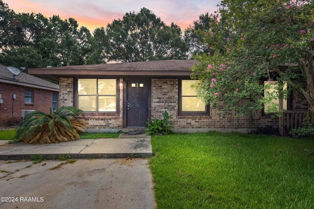 view of front of house with a lawn