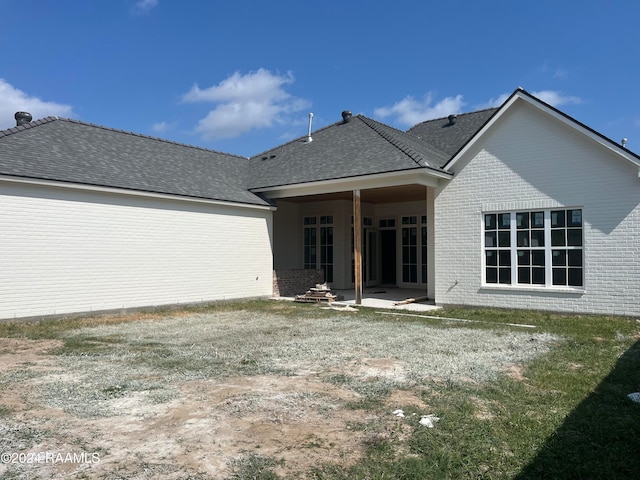 rear view of house with a patio