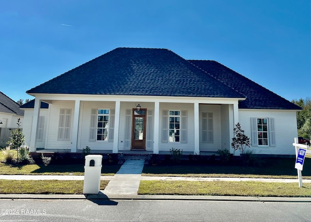 view of front of home featuring covered porch