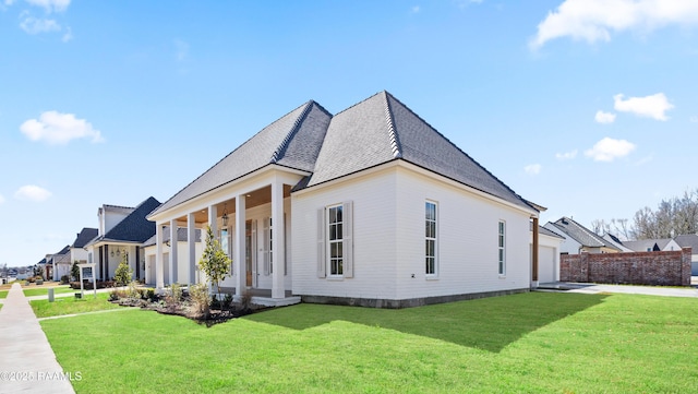 view of property exterior featuring a garage, roof with shingles, a yard, and driveway