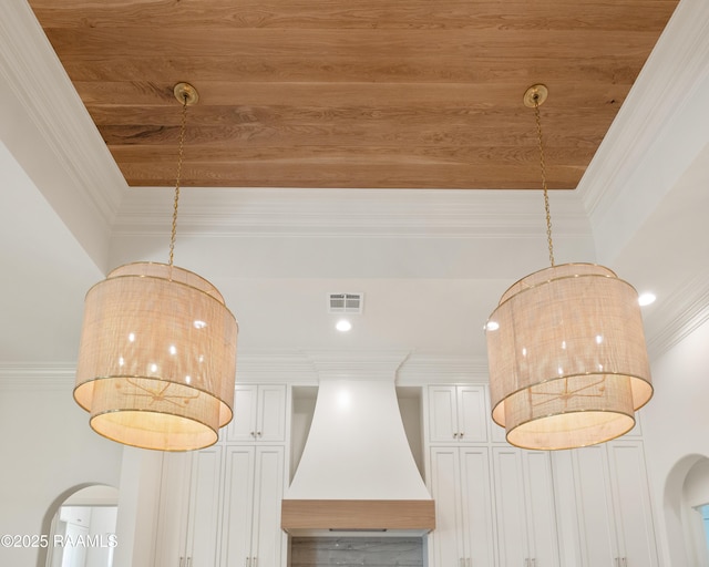 room details with ornamental molding, custom exhaust hood, and visible vents