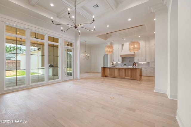 100 Winthorpe Row, Lafayette, LA 70503 - unfurnished living room featuring light wood-style floors, a notable chandelier, coffered ceiling, beamed ceiling, and ornamental molding