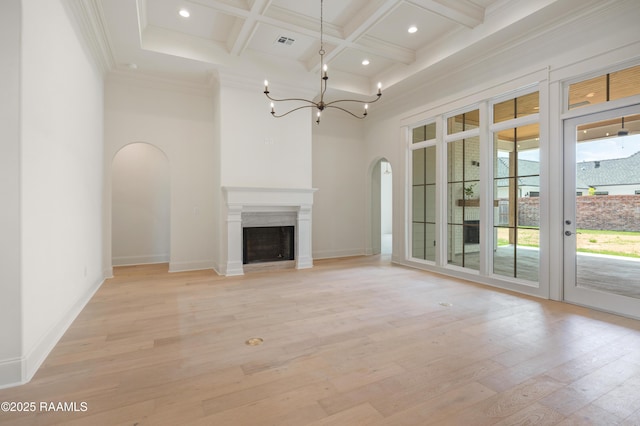 100 Winthorpe Row, Lafayette, LA 70503 - unfurnished living room featuring arched walkways, light wood finished floors, coffered ceiling, ornamental molding, and beam ceiling