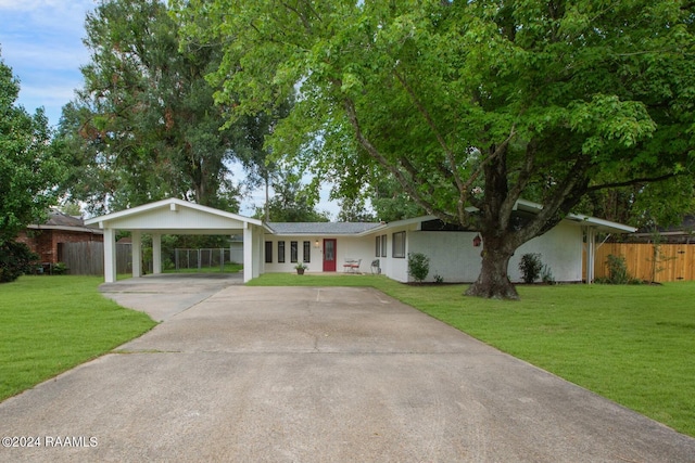 single story home with a carport and a front lawn