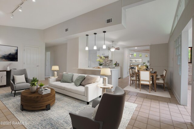 1013 Montrose Blvd, Lafayette, LA 70503 - living room featuring track lighting, ceiling fan, visible vents, and light tile patterned floors