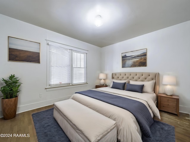 bedroom featuring dark hardwood / wood-style floors