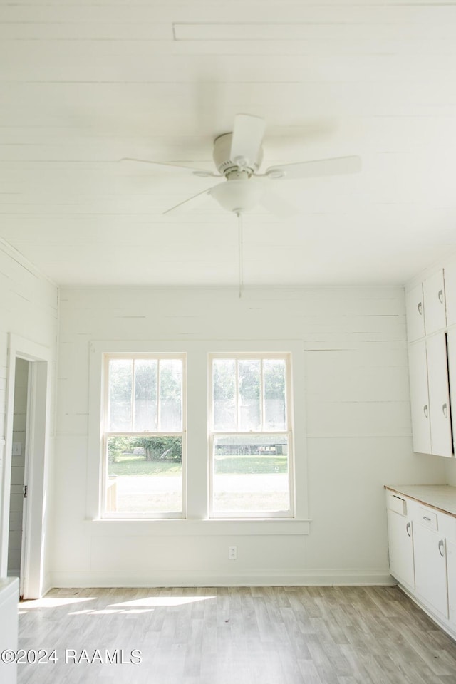 interior space featuring hardwood / wood-style floors and ceiling fan