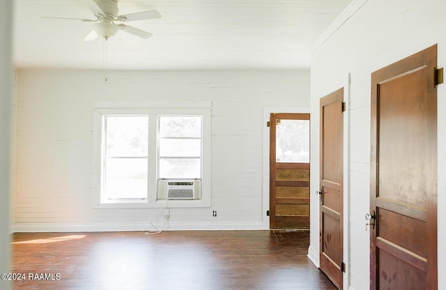 unfurnished room with cooling unit, ceiling fan, dark hardwood / wood-style flooring, and crown molding