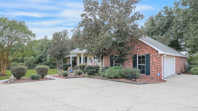 view of front facade featuring covered porch and a garage