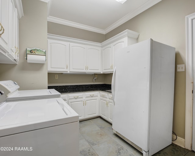 laundry area featuring cabinets, independent washer and dryer, ornamental molding, and light tile patterned floors