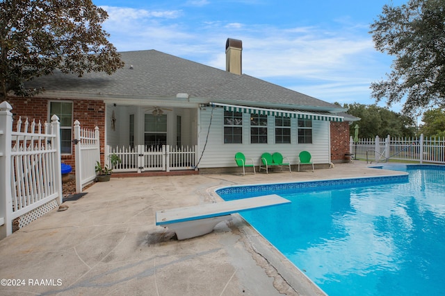 201 Marquette St, New Iberia, LA 70563 - view of pool with a patio area, a diving board, and a gate
