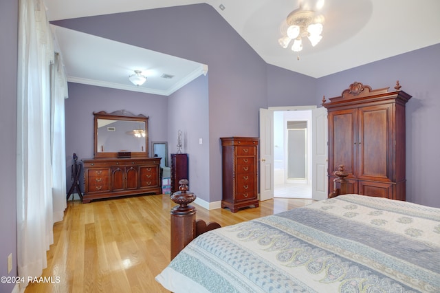 bedroom with light hardwood / wood-style floors, vaulted ceiling, ceiling fan, and ornamental molding