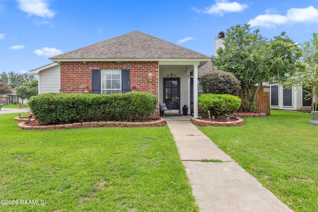 bungalow-style house featuring a front lawn