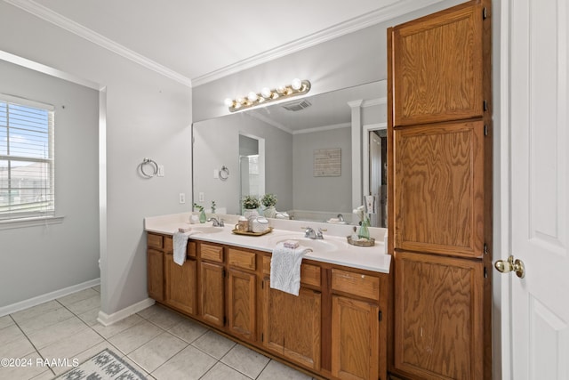 bathroom with crown molding, tile patterned floors, and vanity