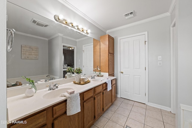 bathroom featuring crown molding, tile patterned floors, vanity, and a tub