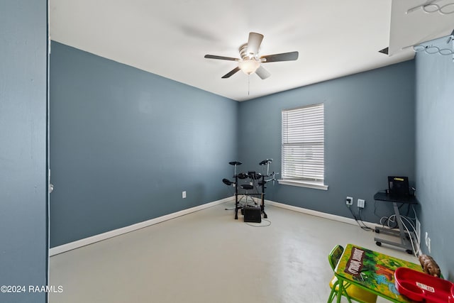 interior space featuring concrete floors and ceiling fan