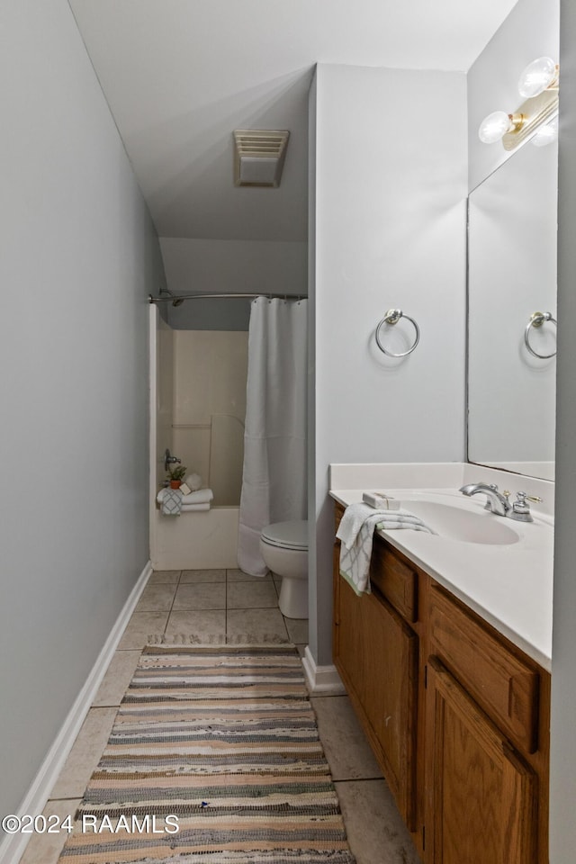 bathroom featuring vanity, toilet, and tile patterned flooring