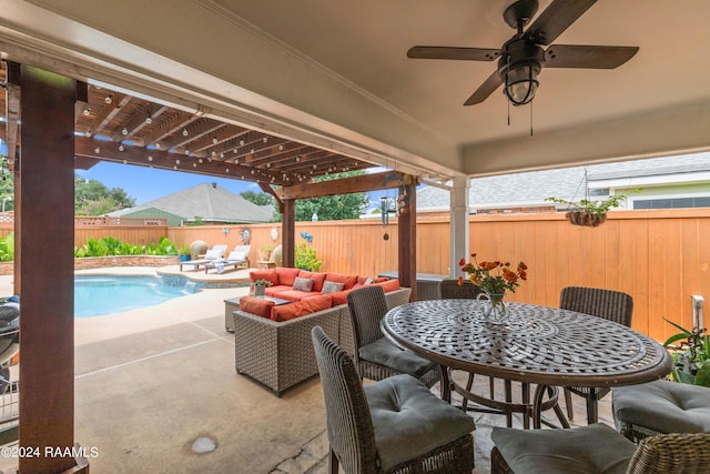 view of patio with a fenced in pool, outdoor lounge area, and ceiling fan