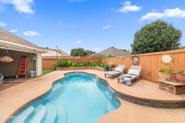 view of swimming pool featuring a patio area