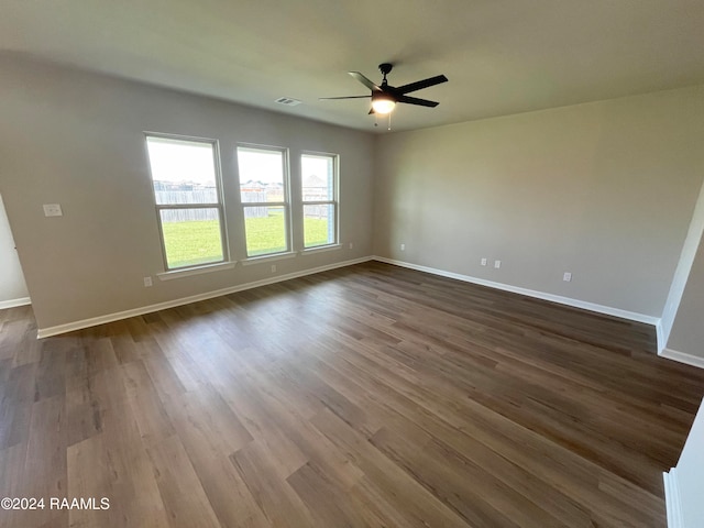 spare room featuring hardwood / wood-style floors and ceiling fan