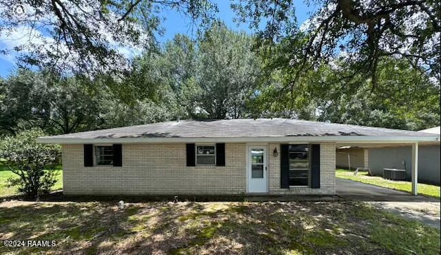 ranch-style house featuring a carport