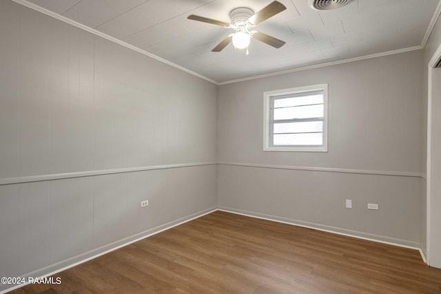 spare room with hardwood / wood-style flooring, ceiling fan, and ornamental molding