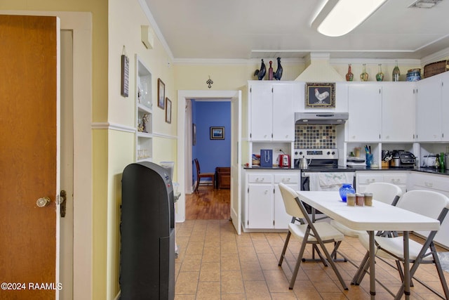 kitchen with stainless steel range with electric stovetop, crown molding, decorative backsplash, and white cabinets