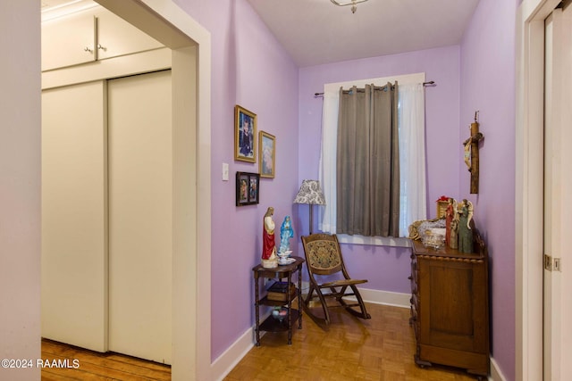 sitting room featuring light parquet flooring